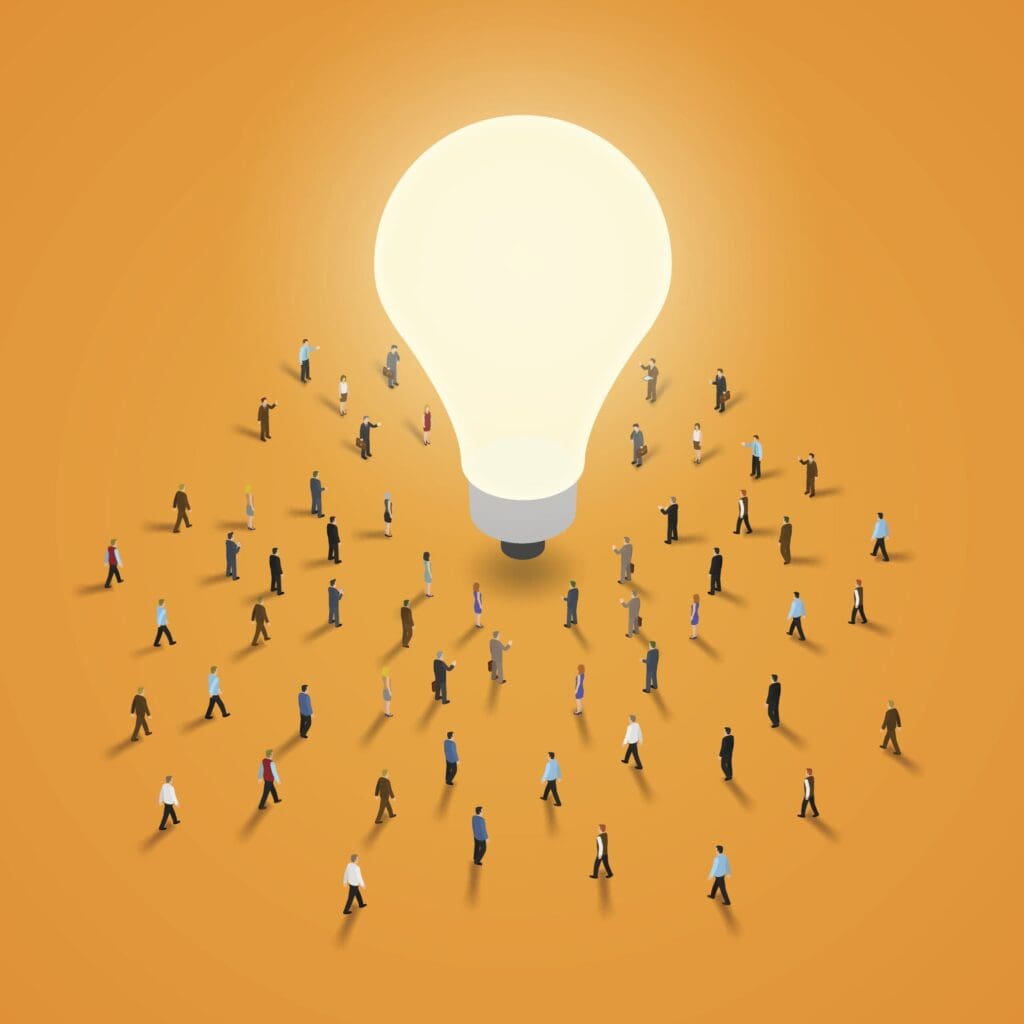 Illustration of a large light bulb surrounded by diverse groups of people on an orange background, symbolizing ideas and collaboration.